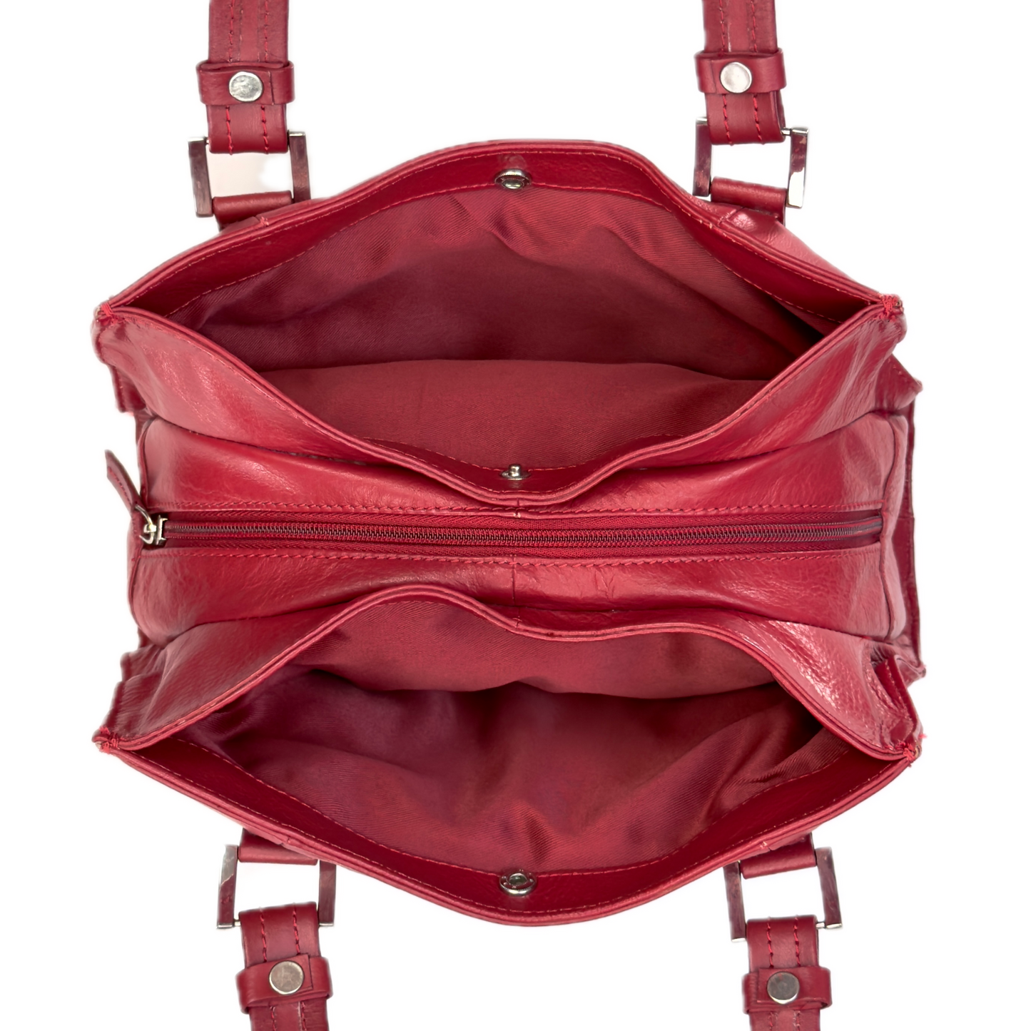 Top-down interior view of a vintage red shoulder bag showing three highly organised compartments and a clean red textile lining.
