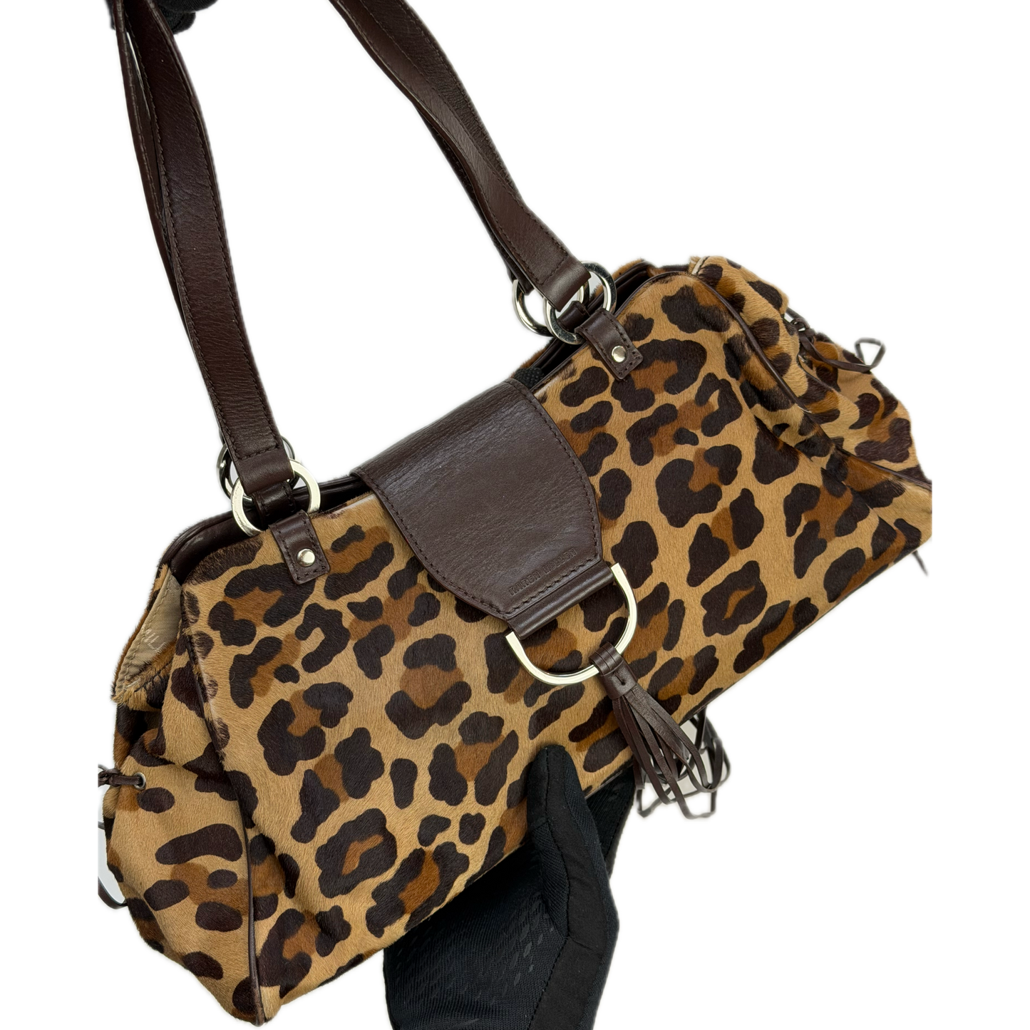 Vintage Karen Millen leopard print pony hair East-West shoulder bag featuring brown leather straps, silver hardware, and a leather fringe tassel.