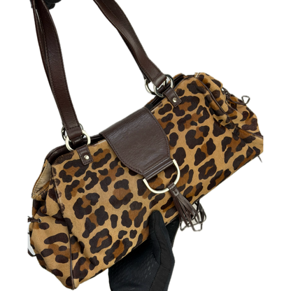 Vintage Karen Millen leopard print pony hair East-West shoulder bag featuring brown leather straps, silver hardware, and a leather fringe tassel.