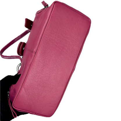 Vintage Clarks hot pink leather top handle bag featuring chunky silver buckle hardware and a triple compartment interior.