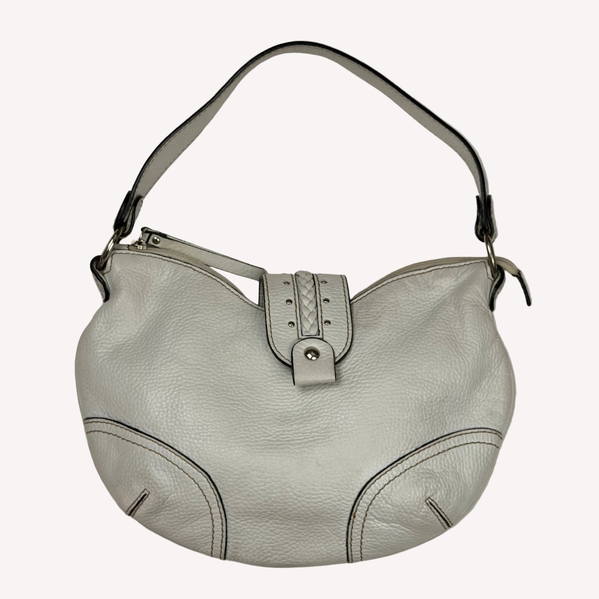 Vintage Coccinelle white pebbled leather hobo bag featuring braided leather details and silver stud hardware.
