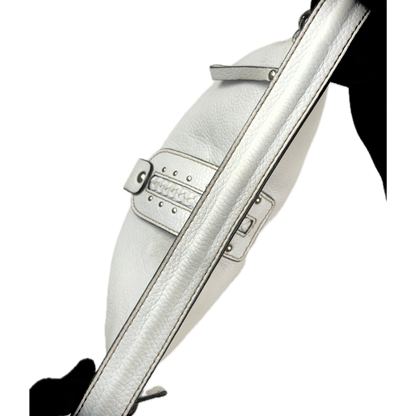 Vintage Coccinelle white pebbled leather hobo bag featuring braided leather details and silver stud hardware.