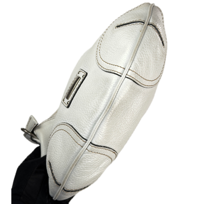 Vintage Coccinelle white pebbled leather hobo bag featuring braided leather details and silver stud hardware.