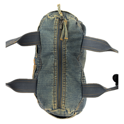 Vintage early 2000s FCUK denim top handle bag featuring a mustard yellow embroidered logo and two front jean pockets.