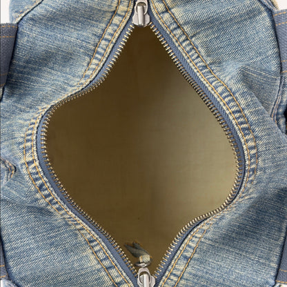 Vintage early 2000s FCUK denim top handle bag featuring a mustard yellow embroidered logo and two front jean pockets.