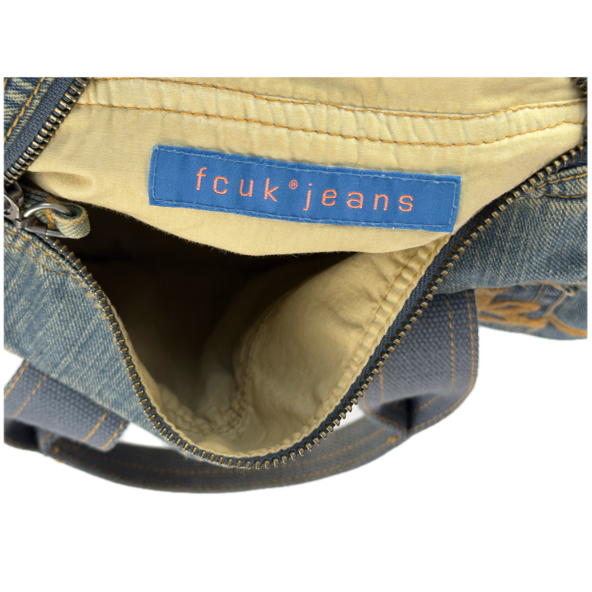 Vintage early 2000s FCUK denim top handle bag featuring a mustard yellow embroidered logo and two front jean pockets.