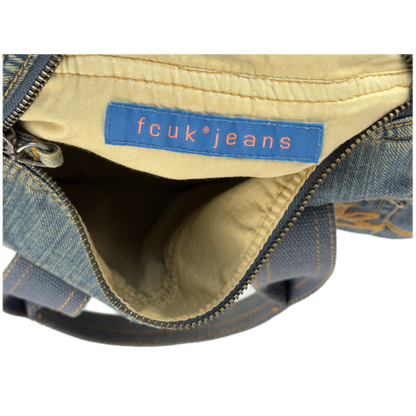 Vintage early 2000s FCUK denim top handle bag featuring a mustard yellow embroidered logo and two front jean pockets.