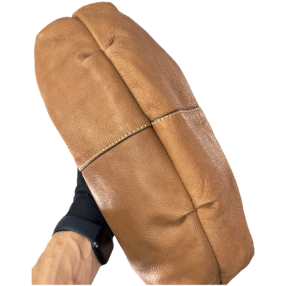 Vintage Fossil tan brown leather hobo bag featuring a braided shoulder strap, silver studs, and a signature key charm.