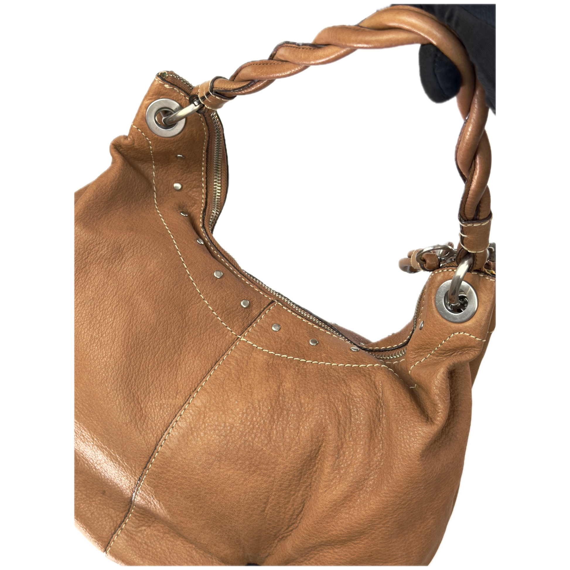 Vintage Fossil tan brown leather hobo bag featuring a braided shoulder strap, silver studs, and a signature key charm.