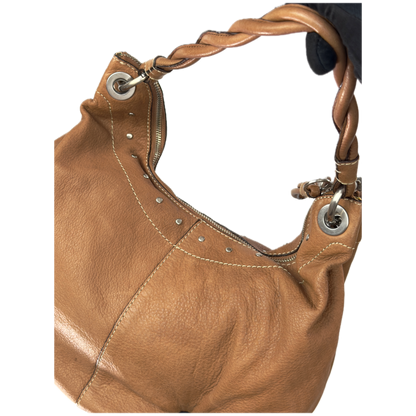 Vintage Fossil tan brown leather hobo bag featuring a braided shoulder strap, silver studs, and a signature key charm.