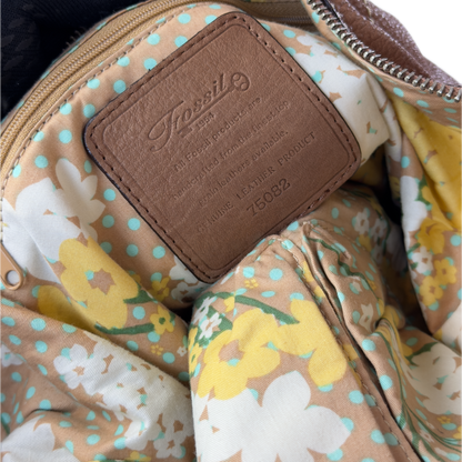 Vintage Fossil tan brown leather hobo bag featuring a braided shoulder strap, silver studs, and a signature key charm.