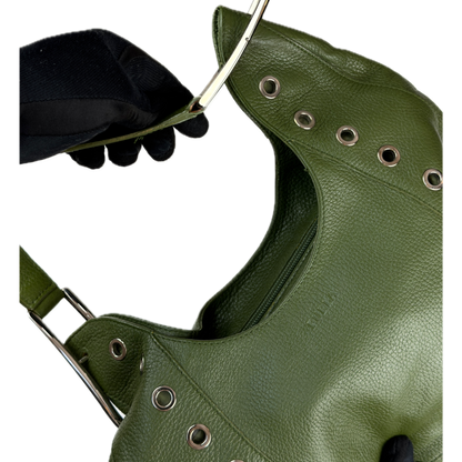 Vintage Furla forest green pebbled leather hobo bag featuring silver eyelet hardware and a structural shoulder strap.
