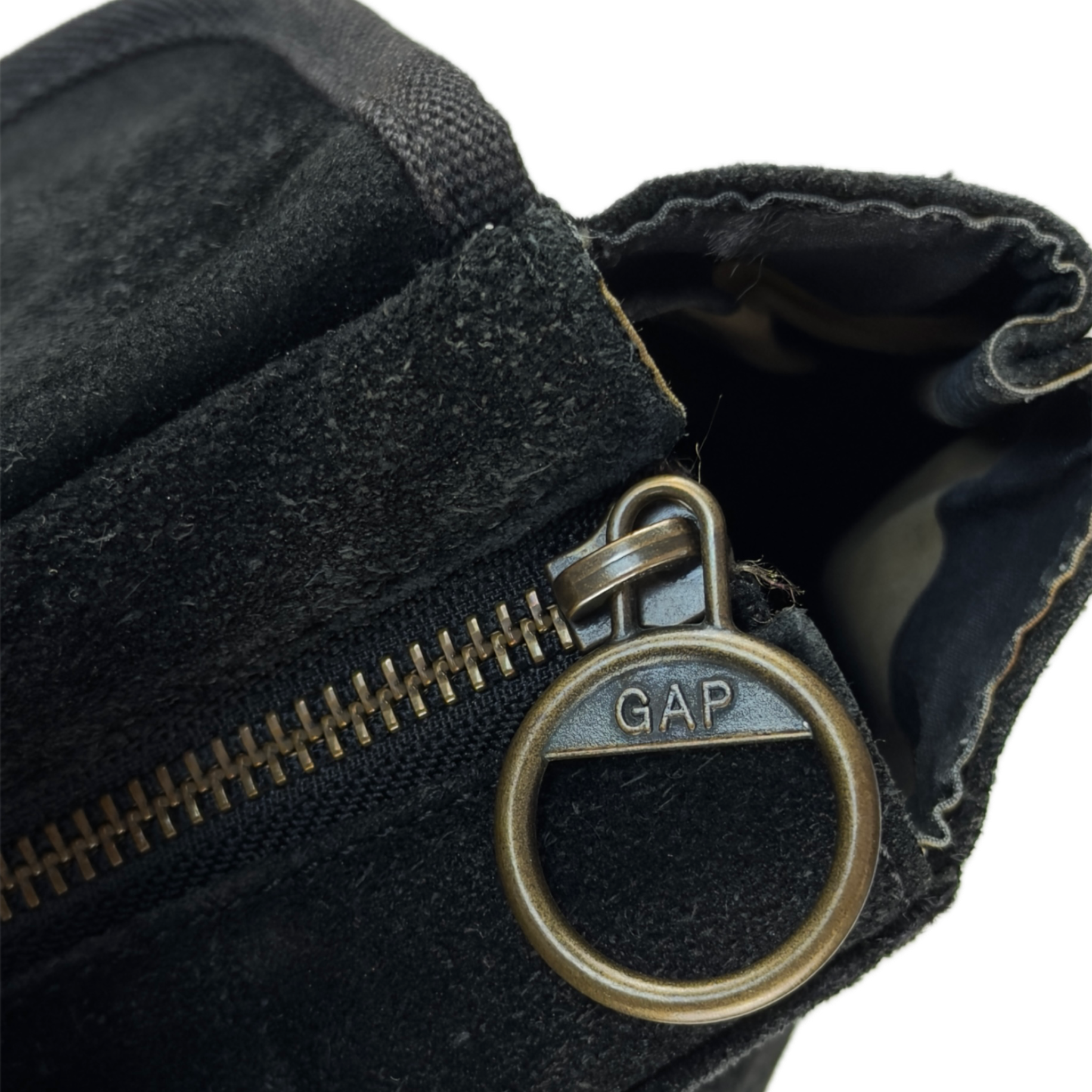 Vintage Gap black genuine suede shoulder bag featuring brass hardware and an oversized front button pocket.