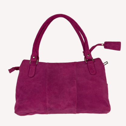 Vintage Y2K Jasper Conran shoulder bag in vibrant magenta pink suede, featuring three front pockets with silver twist-lock hardware and double straps.