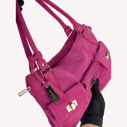 Vintage Y2K Jasper Conran shoulder bag in vibrant magenta pink suede, featuring three front pockets with silver twist-lock hardware and double straps.