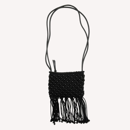 A vintage Jigsaw black long strap shoulder bag featuring beaded tassel detailing.