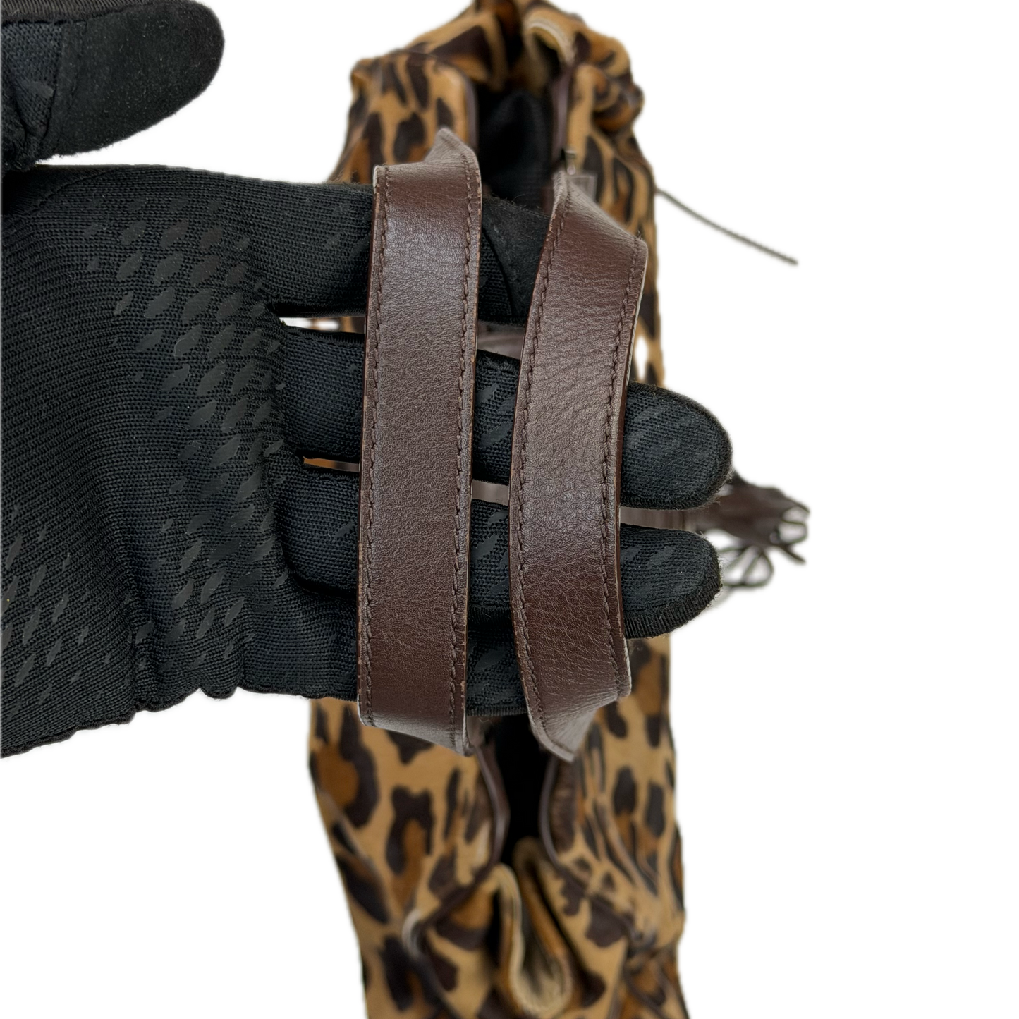 Vintage Karen Millen leopard print pony hair East-West shoulder bag featuring brown leather straps, silver hardware, and a leather fringe tassel.