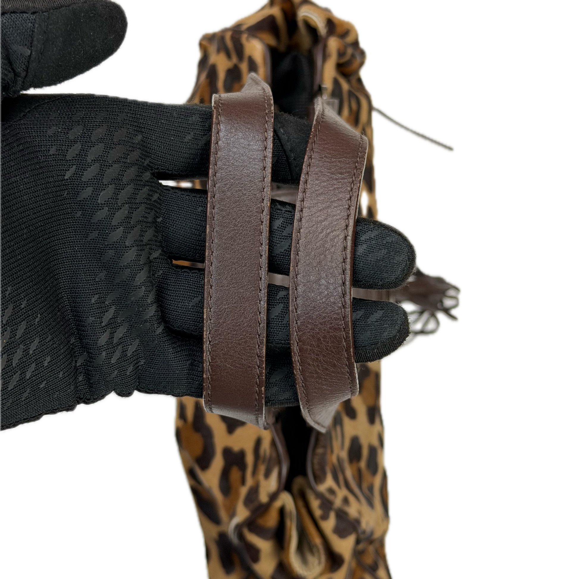 Vintage Karen Millen leopard print pony hair East-West shoulder bag featuring brown leather straps, silver hardware, and a leather fringe tassel.