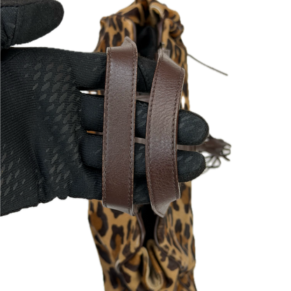 Vintage Karen Millen leopard print pony hair East-West shoulder bag featuring brown leather straps, silver hardware, and a leather fringe tassel.