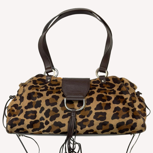 Vintage Karen Millen leopard print pony hair East-West shoulder bag featuring brown leather straps, silver hardware, and a leather fringe tassel.