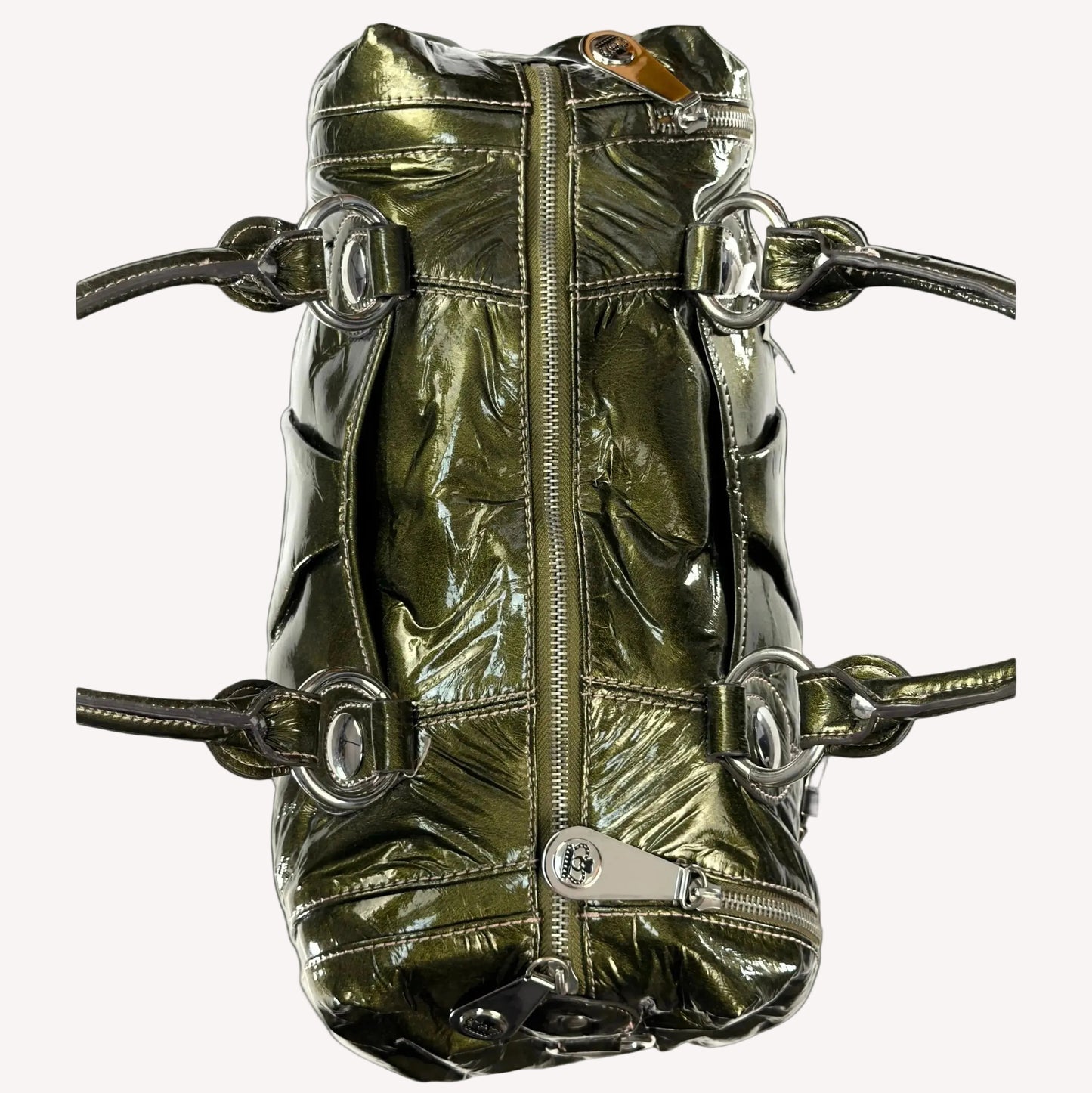 Heavy antique silver-tone buckle hardware and crown detailing on a vintage 2000s Kathy Van Zeeland McBling bag.