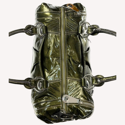 Heavy antique silver-tone buckle hardware and crown detailing on a vintage 2000s Kathy Van Zeeland McBling bag.