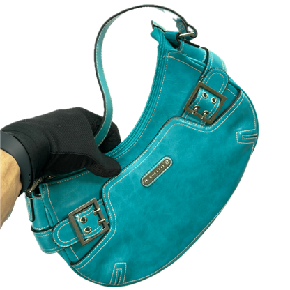 A vintage Y2K Rosetti blue crescent shoulder bag featuring a front buckle detail.