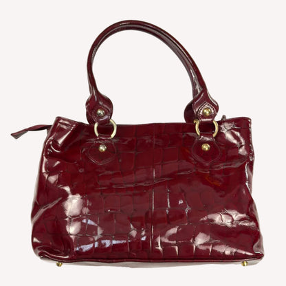 Vintage Russell & Bromley glossy red croc-embossed patent leather tote bag featuring gold chain and padlock hardware.
