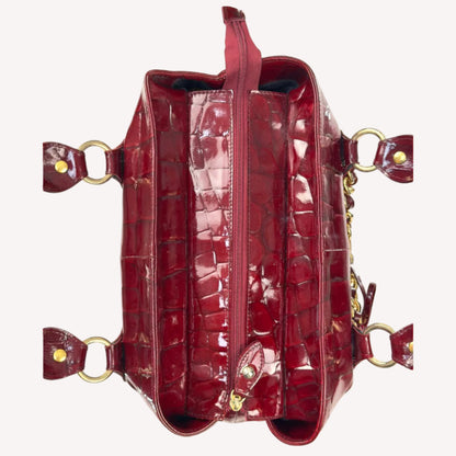 Vintage Russell & Bromley glossy red croc-embossed patent leather tote bag featuring gold chain and padlock hardware.