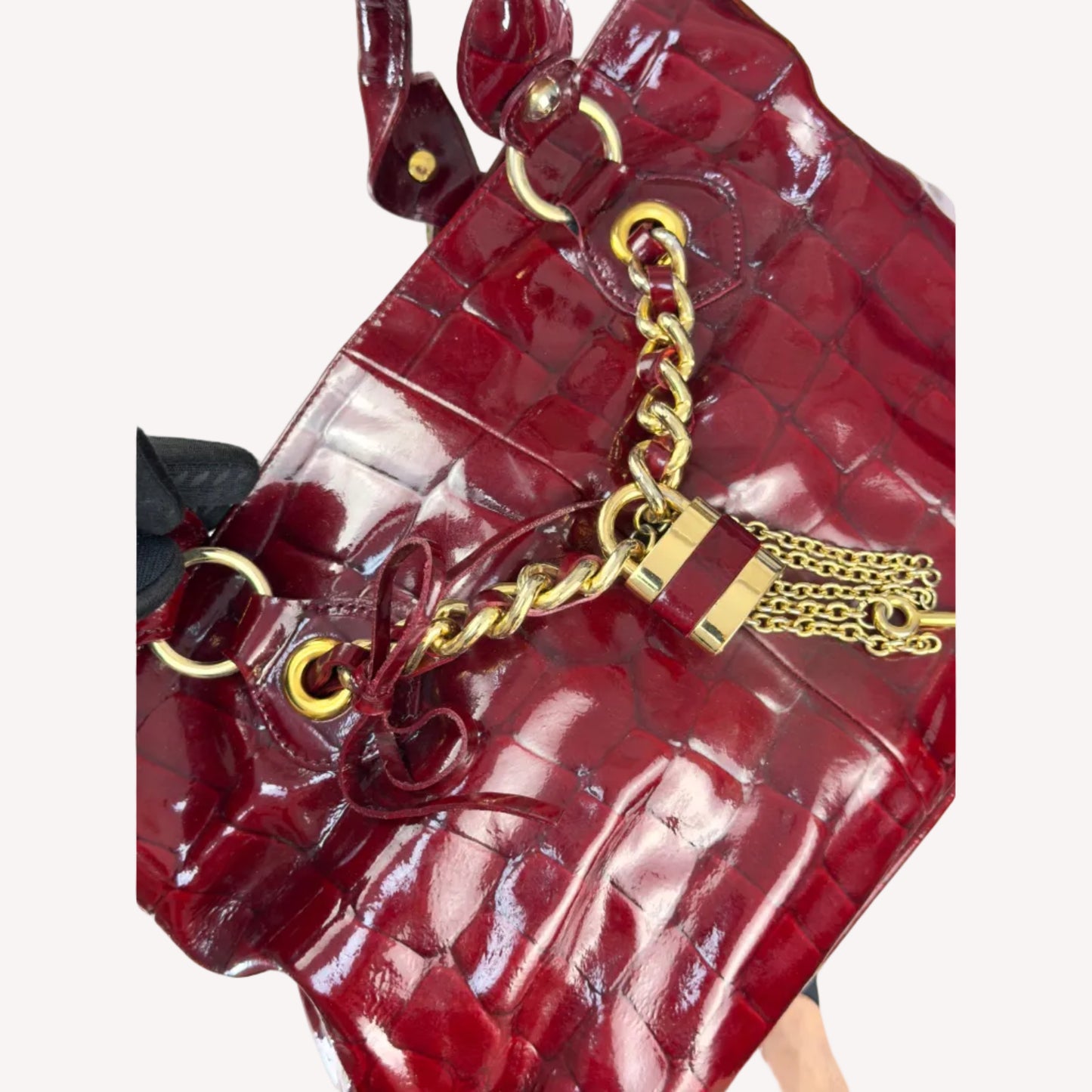 Vintage Russell & Bromley glossy red croc-embossed patent leather tote bag featuring gold chain and padlock hardware.