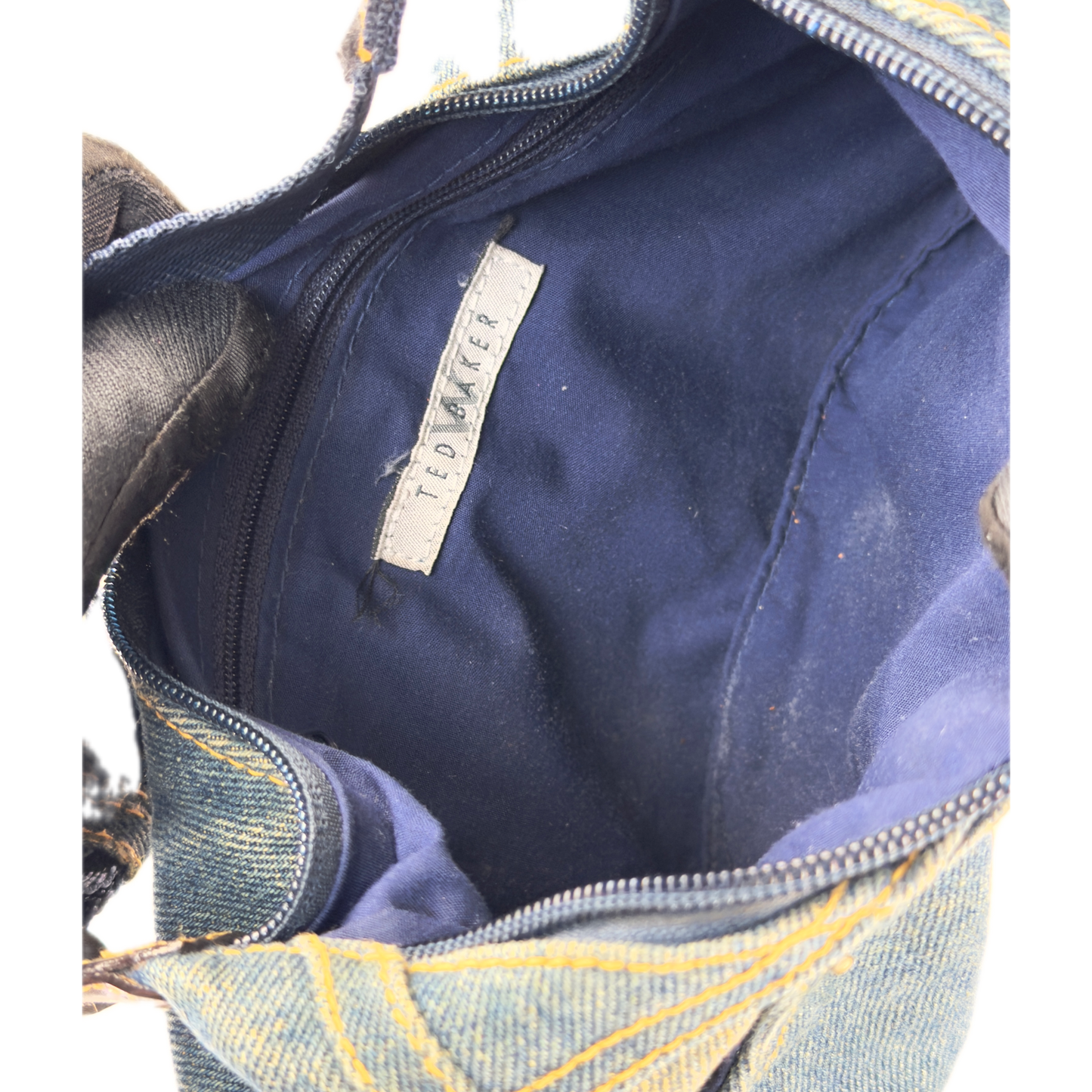 Vintage Ted Baker blue denim hobo shoulder bag featuring contrast yellow stitching, front jean pockets, and a canvas strap.