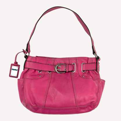 Vintage Y2K Tignanello hot pink pebbled leather shoulder bag featuring a statement silver front buckle, side slip pockets, and a branded metal hanging tag.