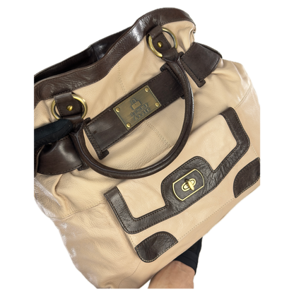 Vintage Tommy & Kate oversized slouchy tote bag in cream and chocolate brown leather, featuring brass hardware and a front pocket.