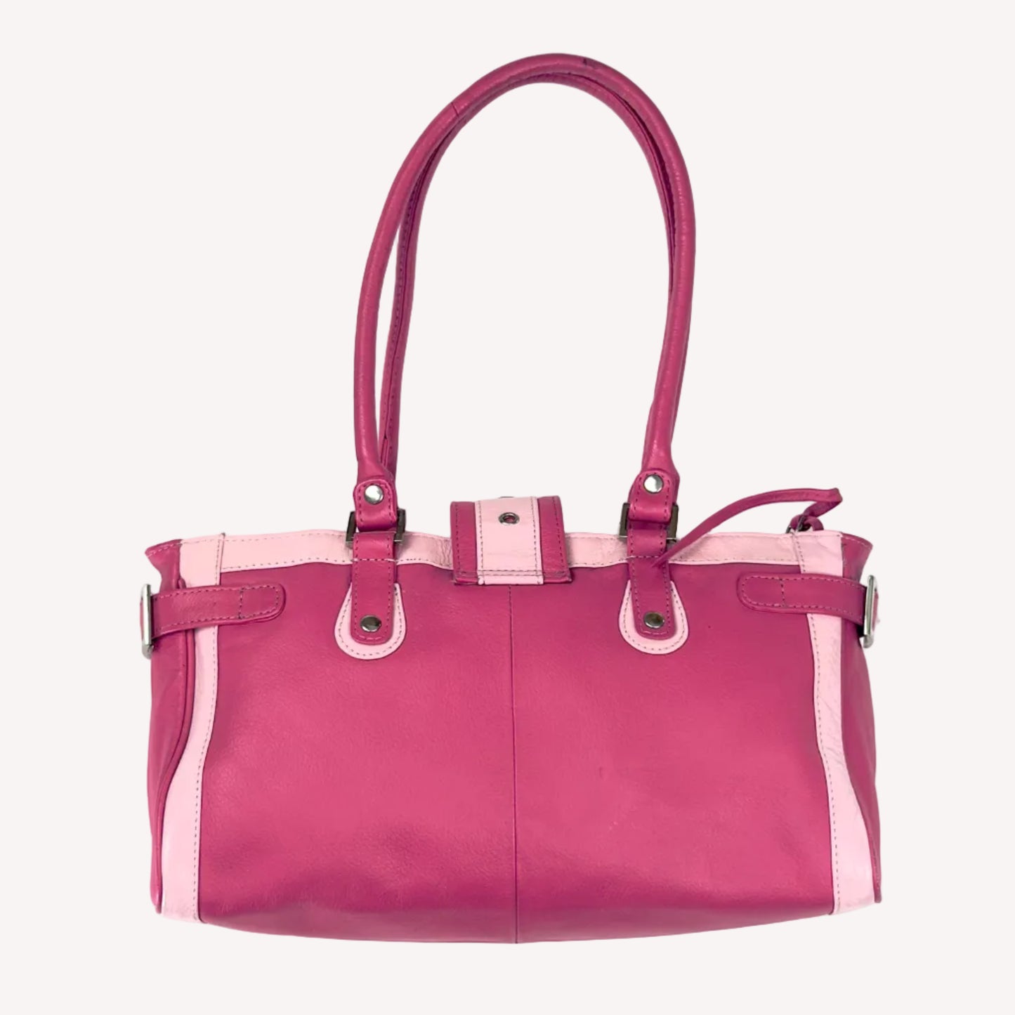 Vintage Y2K two-tone leather shoulder bag featuring a hot pink body, pale baby pink accents, and a silver front buckle.
