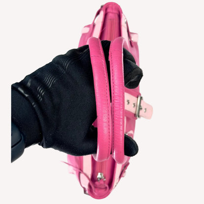 Vintage Y2K two-tone leather shoulder bag featuring a hot pink body, pale baby pink accents, and a silver front buckle.