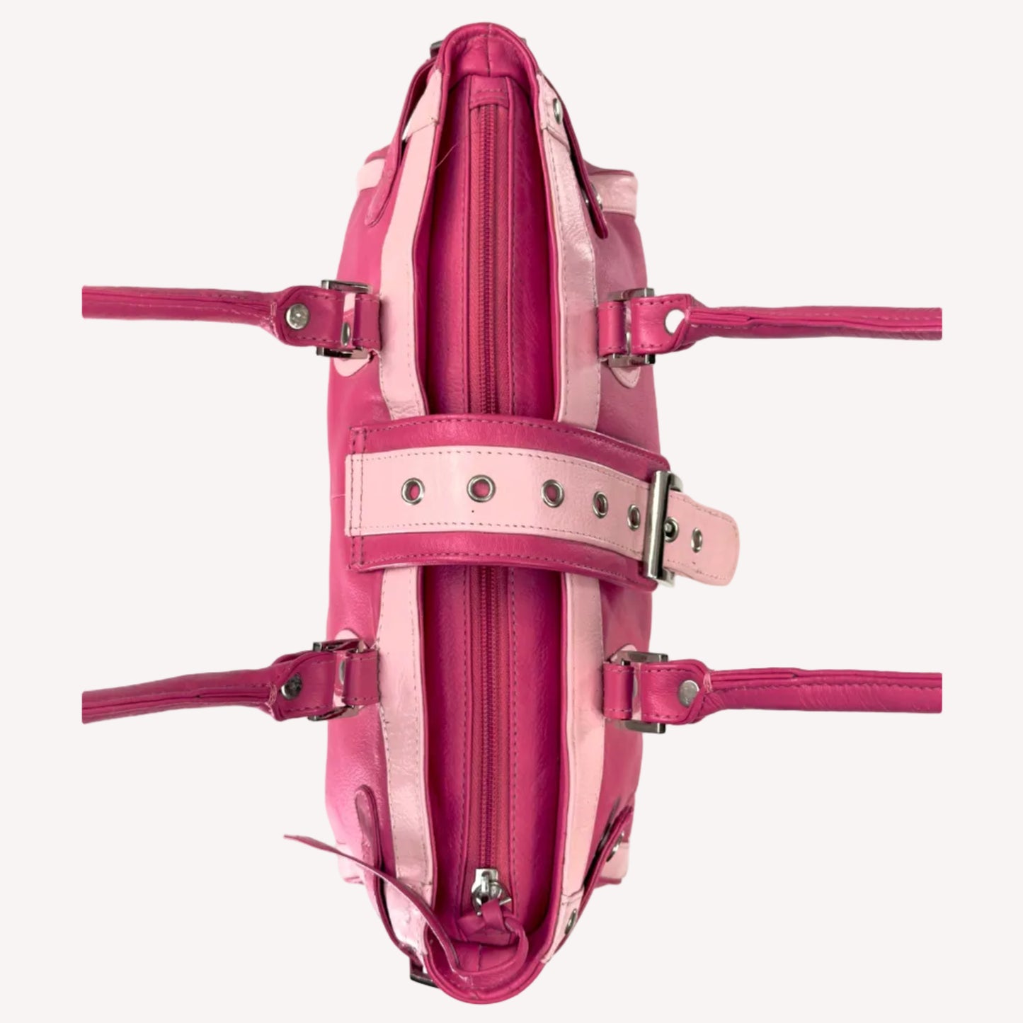 Vintage Y2K two-tone leather shoulder bag featuring a hot pink body, pale baby pink accents, and a silver front buckle.