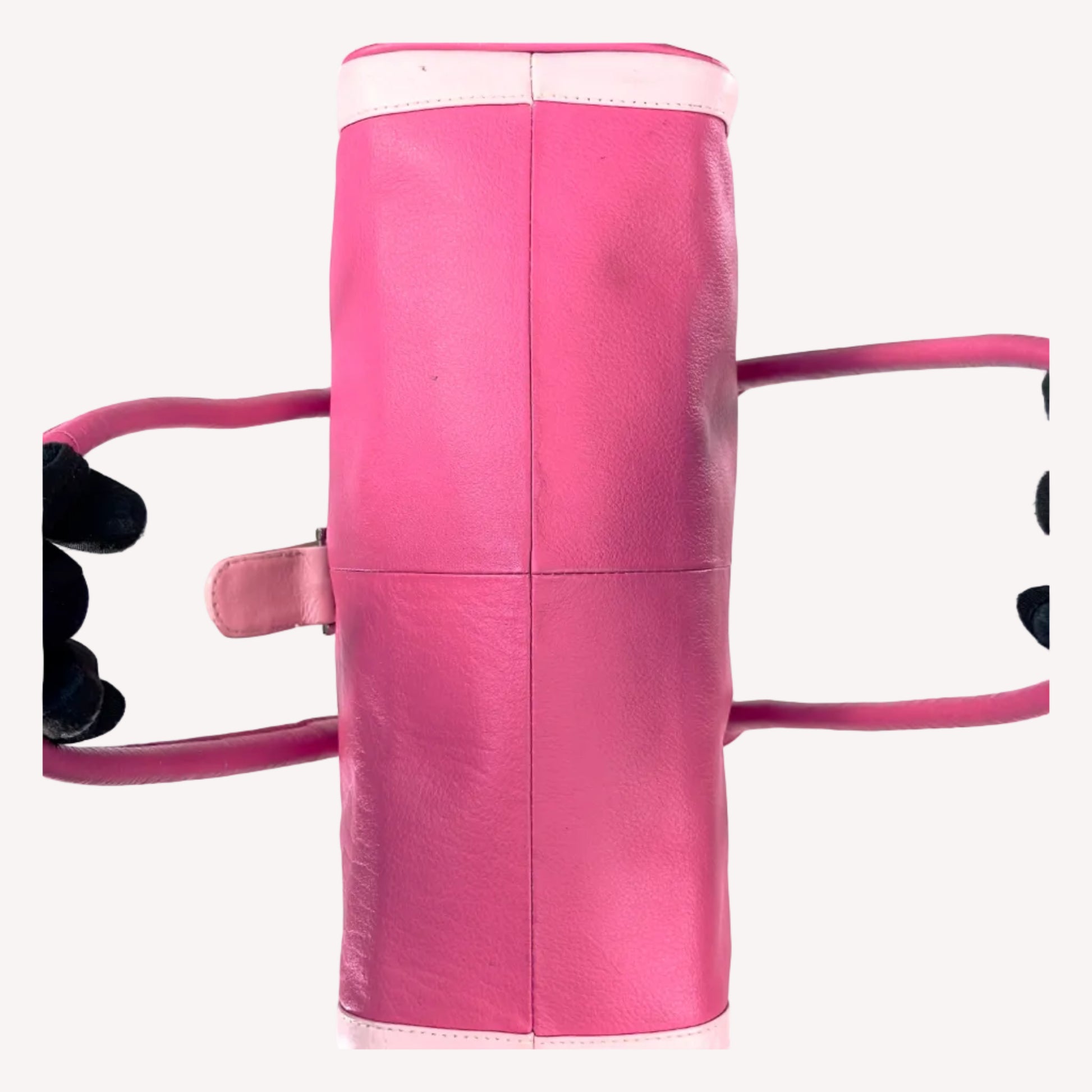 Vintage Y2K two-tone leather shoulder bag featuring a hot pink body, pale baby pink accents, and a silver front buckle.