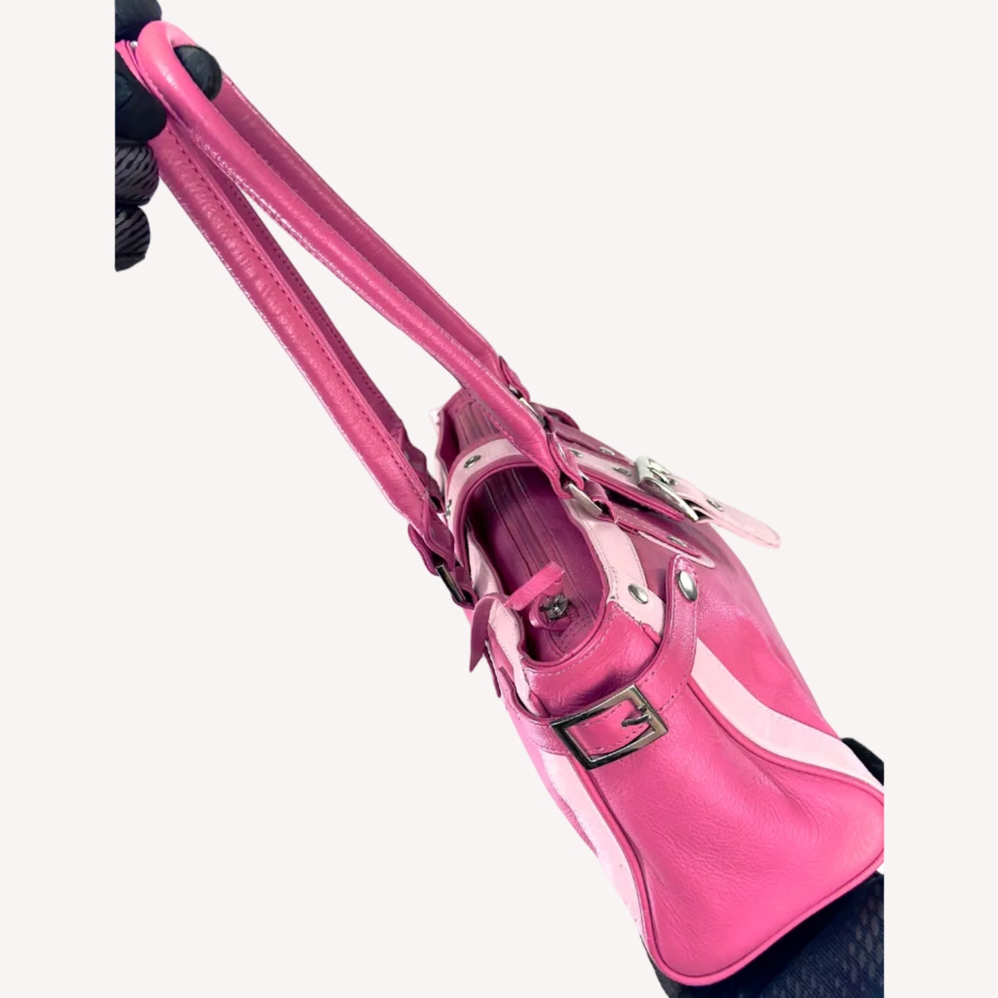 Vintage Y2K two-tone leather shoulder bag featuring a hot pink body, pale baby pink accents, and a silver front buckle.