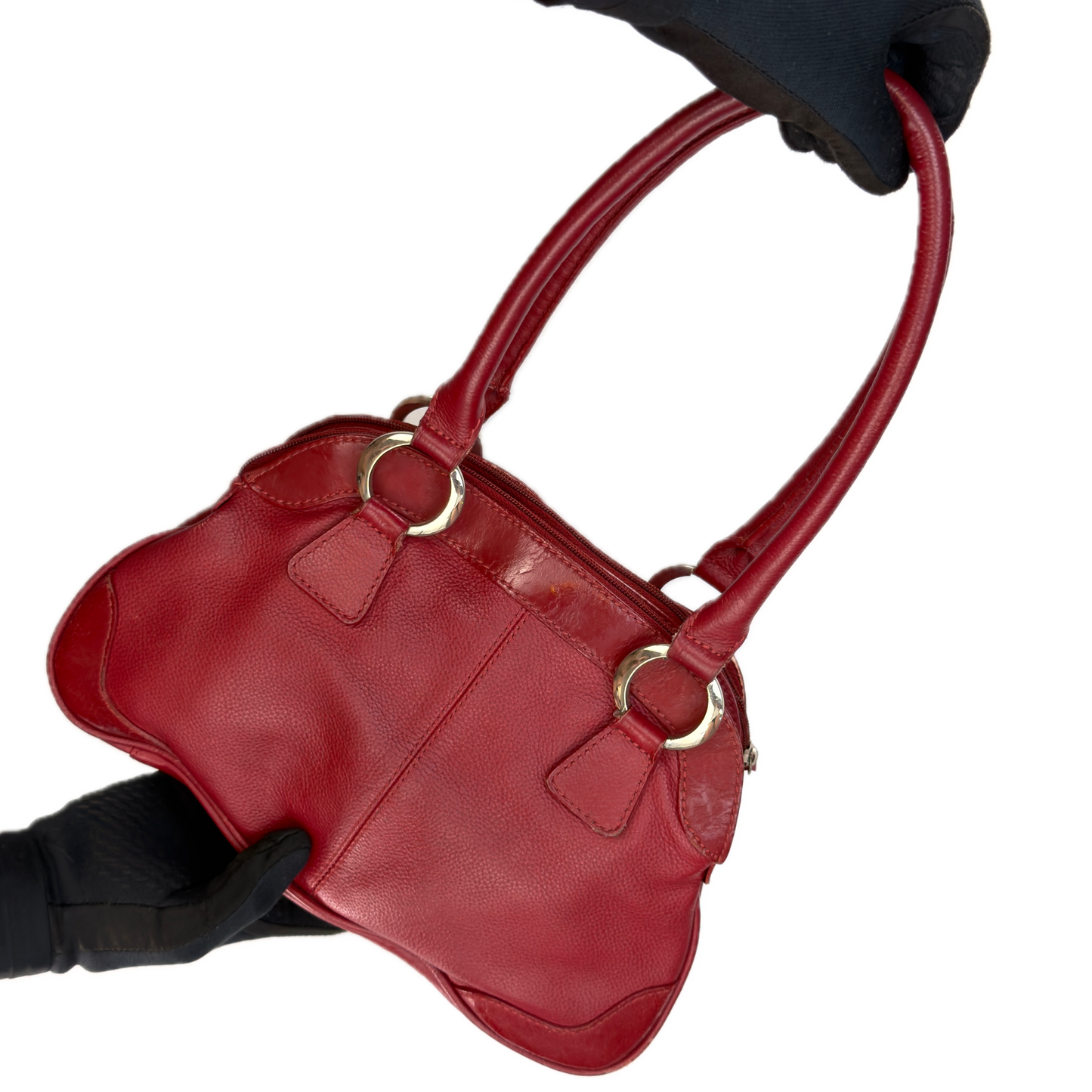 Front view of an elongated vintage Y2K Collection by Debenhams red genuine leather shoulder bag with silver hardware.