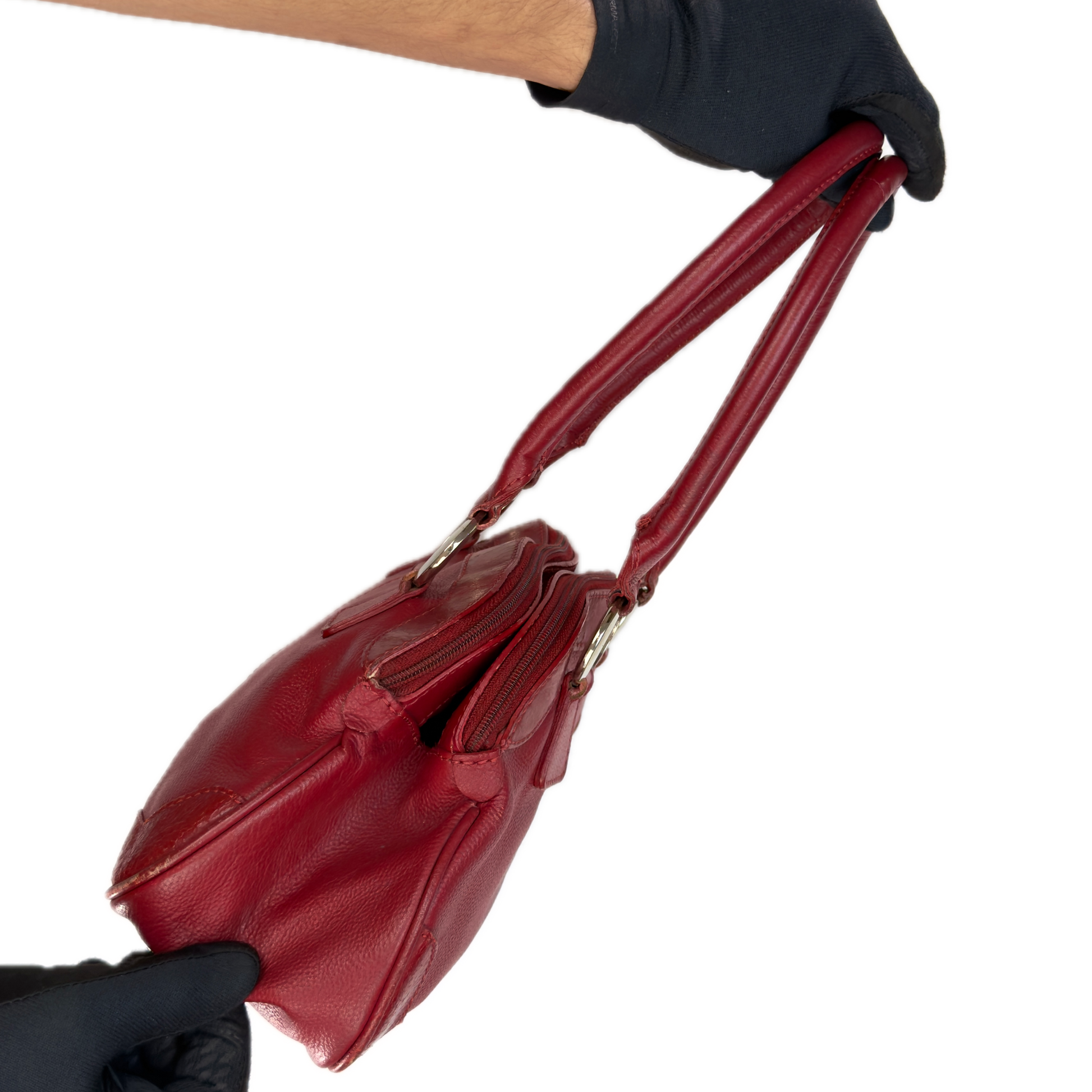 Side view of an elongated vintage Y2K Collection by Debenhams red genuine leather shoulder bag with silver hardware.