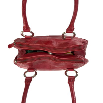Aerial view of an elongated vintage Y2K Collection by Debenhams red genuine leather shoulder bag with silver hardware.
