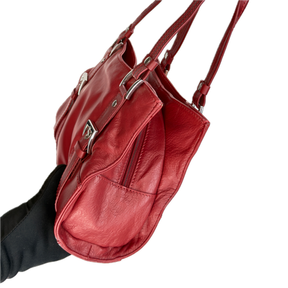 Side view of a structured vintage Y2K Collection by Debenhams glossy red shoulder bag featuring silver-tone buckle details. 