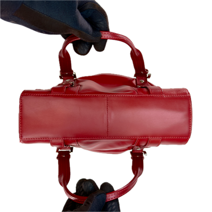 Structured vintage Y2K Collection by Debenhams glossy red shoulder bag featuring silver-tone buckle details.