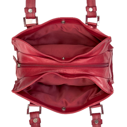 Top-down interior view of a vintage red shoulder bag showing three highly organised compartments and a clean red textile lining.