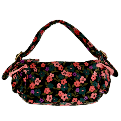 Rear view of a vintage Y2K GAP black cotton velour baguette shoulder bag with a plush velvety texture against a black background.