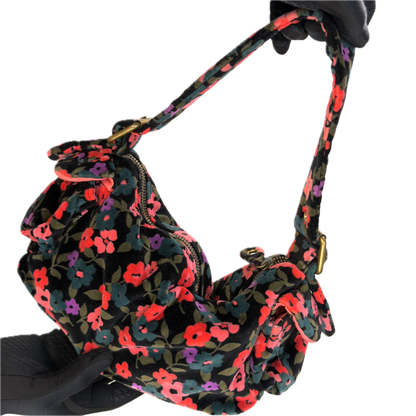 Front view of a vintage Y2K GAP black cotton velour baguette shoulder bag with a plush velvety texture against a black background.