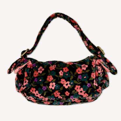 Front view of a vintage Y2K GAP black cotton velour baguette shoulder bag with a plush velvety texture against a black background.