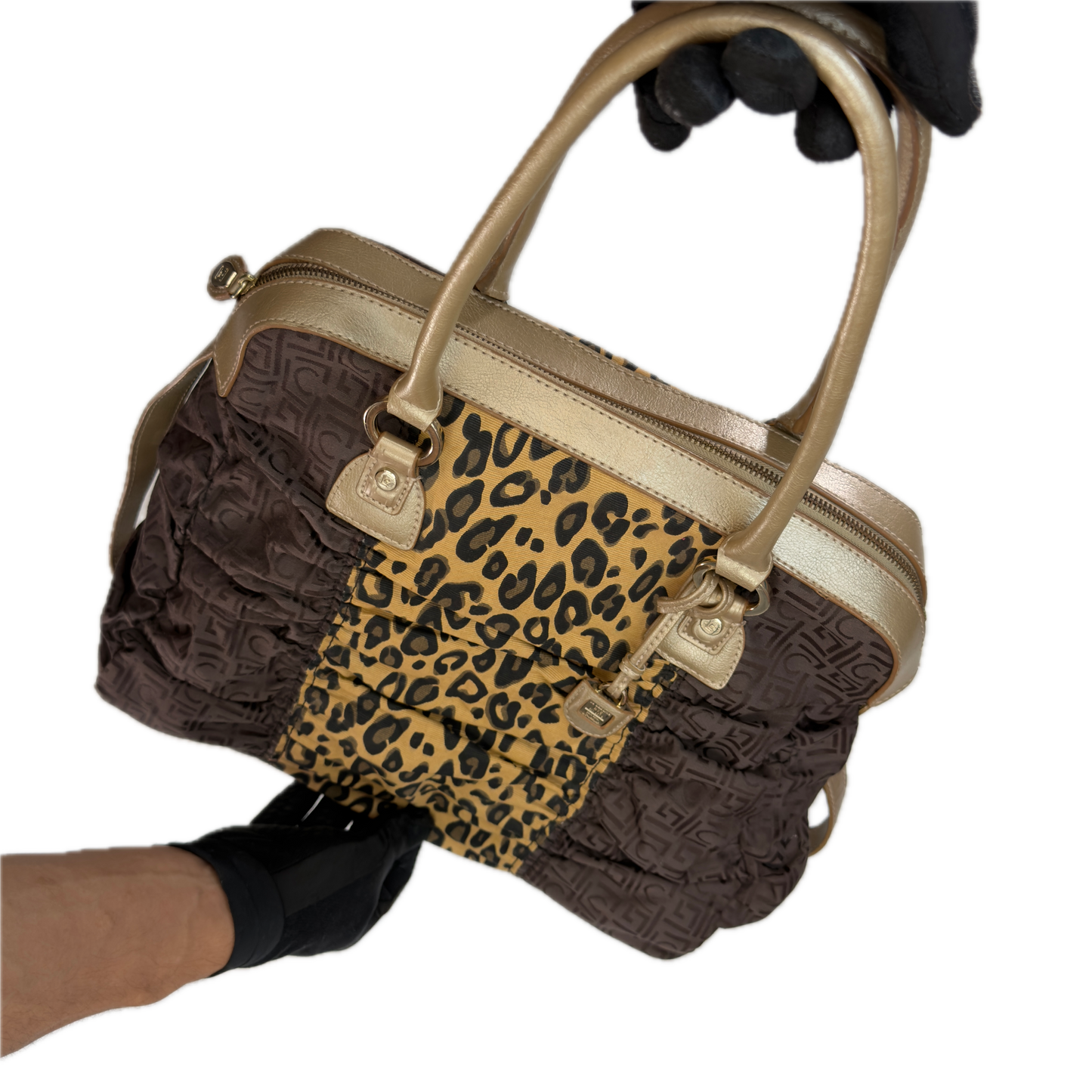 Front view of a vintage Y2K Liz Claiborne brown zebra animal print tote bag featuring tonal brown faux leather handles against a black background.