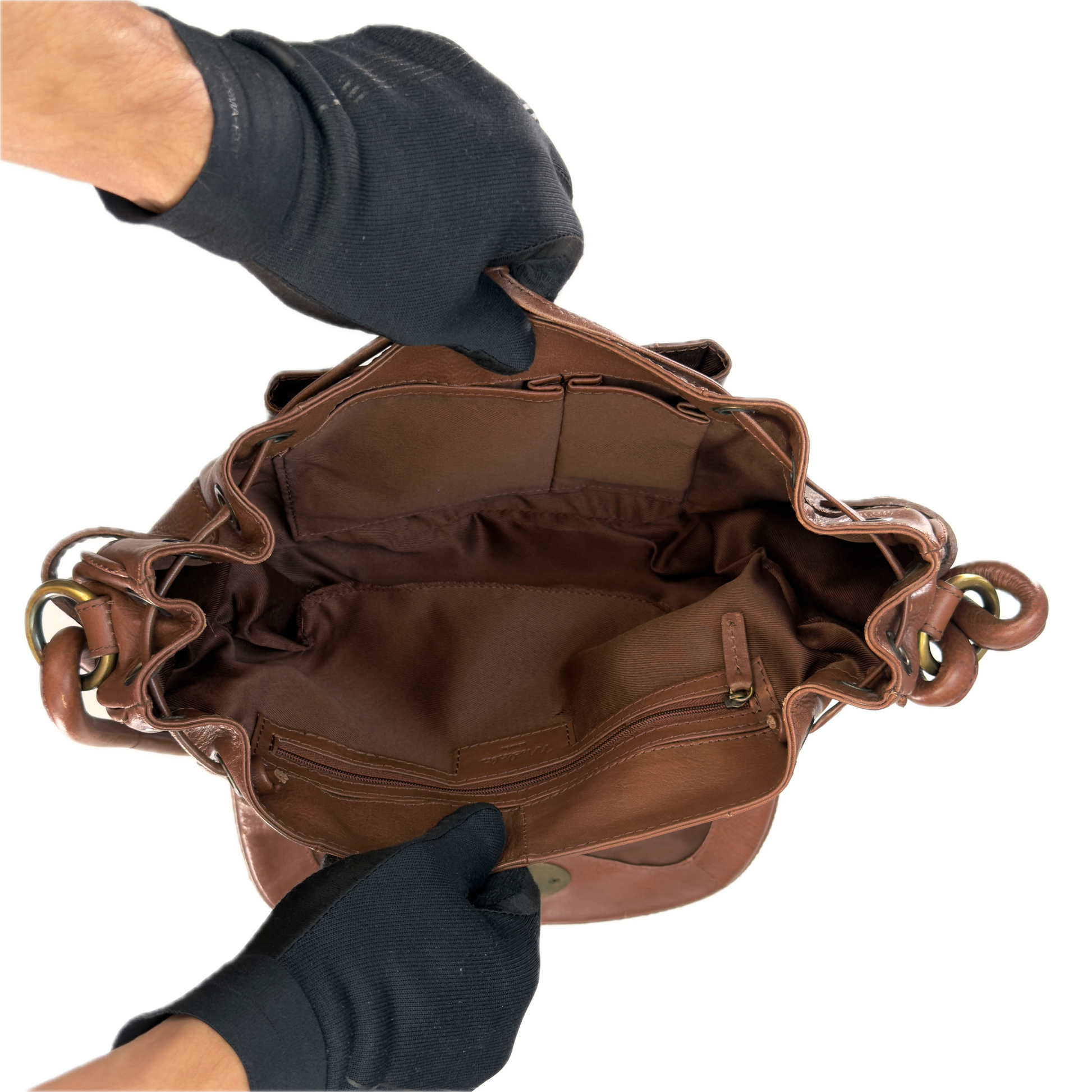 Close-up interior view of a vintage Modalu tan leather bag showing the clean lining and the authentic stitched leather Modalu brand patch.