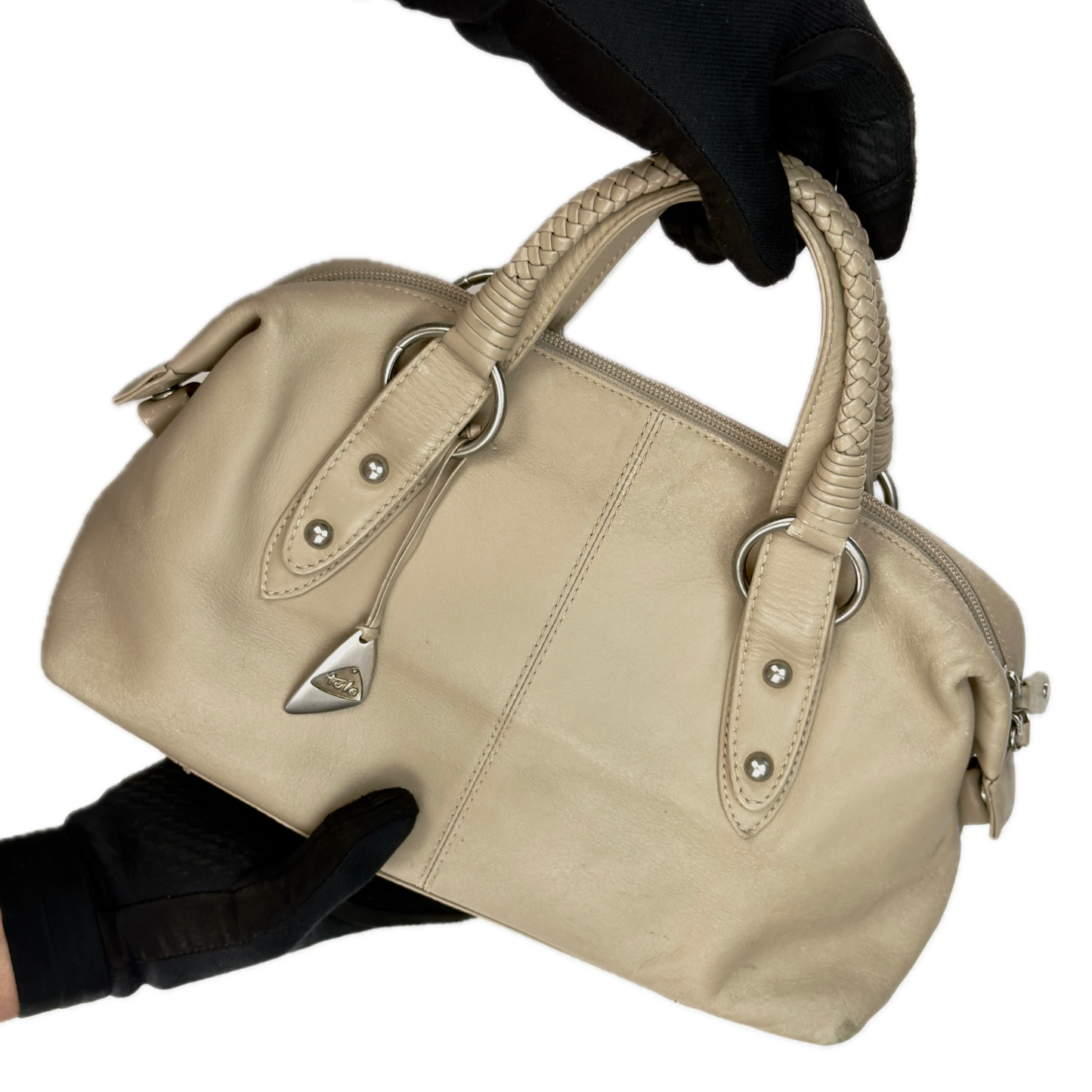 Front view of a structured vintage Y2K Tula cool beige genuine leather top handle bag with silver hardware.